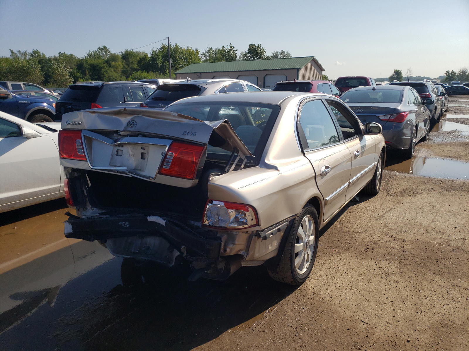 Photo 4 from auction – 2005 KIA OPTIMA LX with VIN KNAGD128655396406