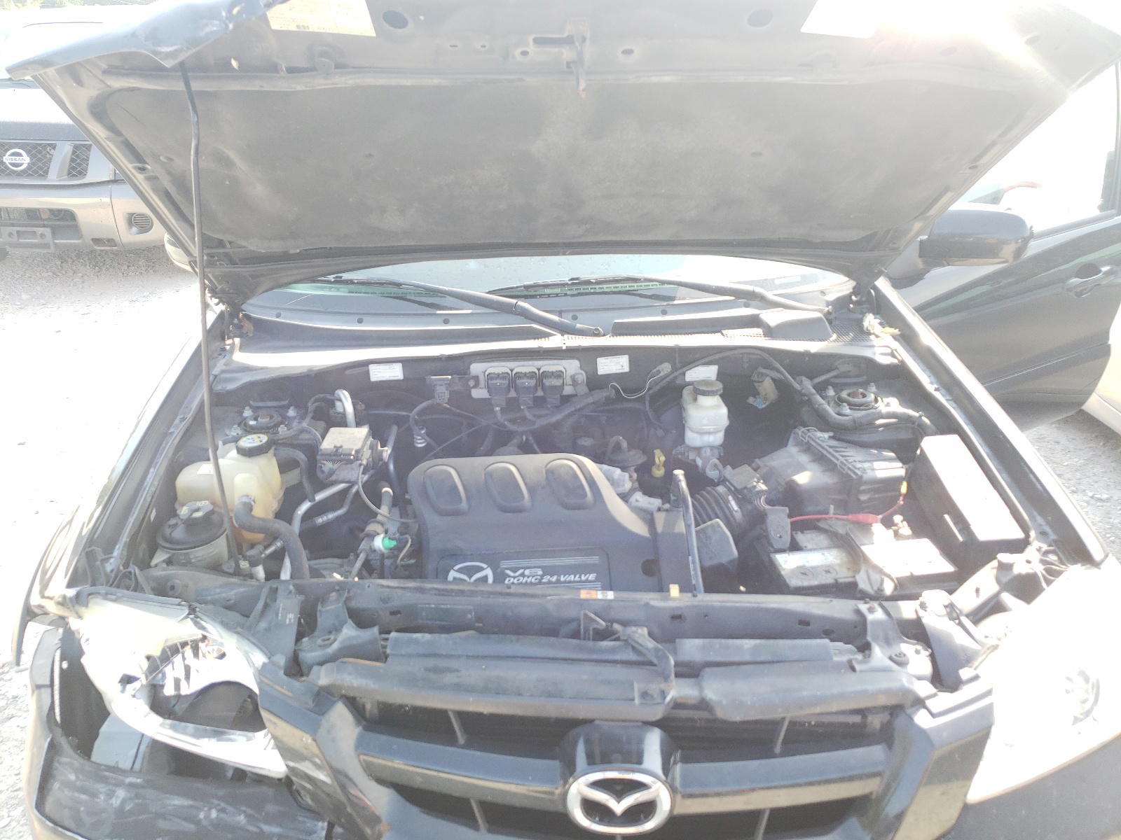 Photo 7 from auction – 2005 MAZDA TRIBUTE S with VIN 4F2CZ96165KM04245