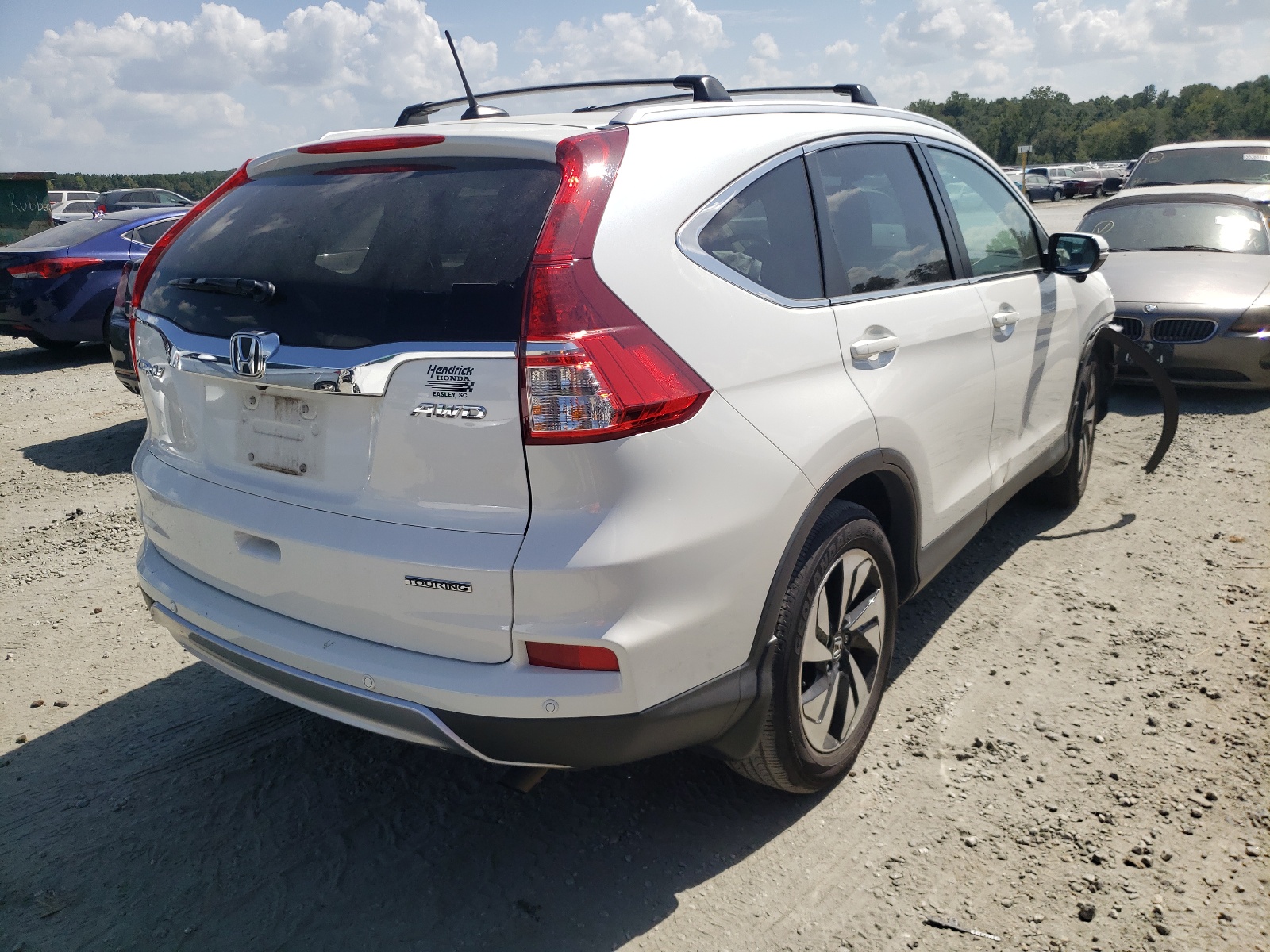 Photo 4 from auction – 2015 HONDA CR-V TOURI with VIN 5J6RM4H90FL116239