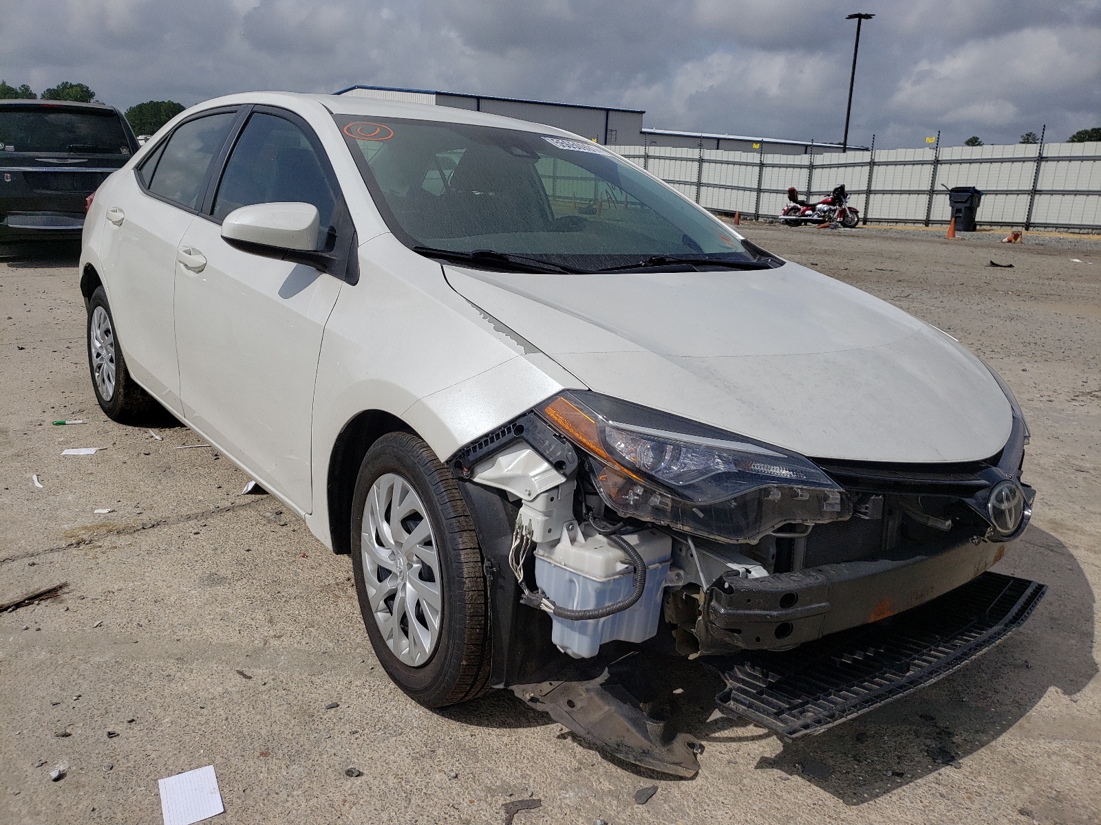 TOYOTA COROLLA L 2017 with VIN 5YFBURHE5HP648064 - Photo from auction