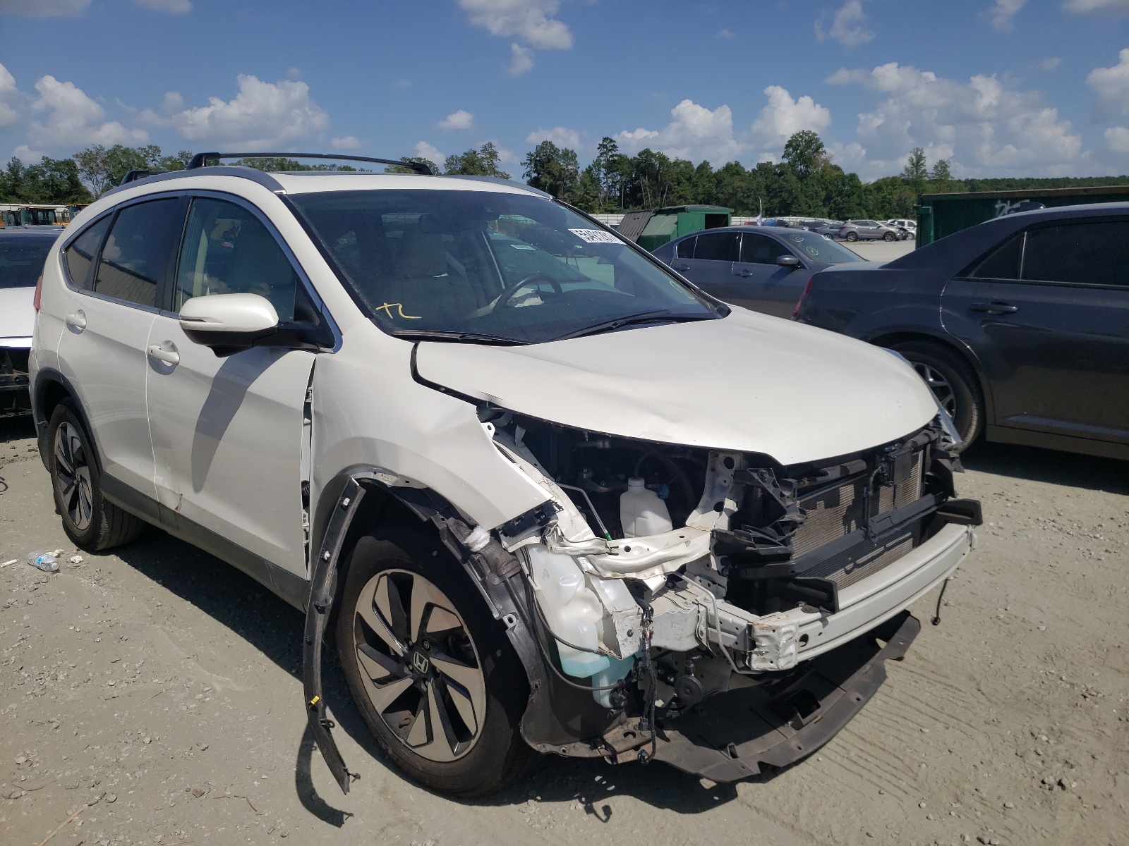 HONDA CR-V TOURI 2015 with VIN 5J6RM4H90FL116239 - Photo from auction