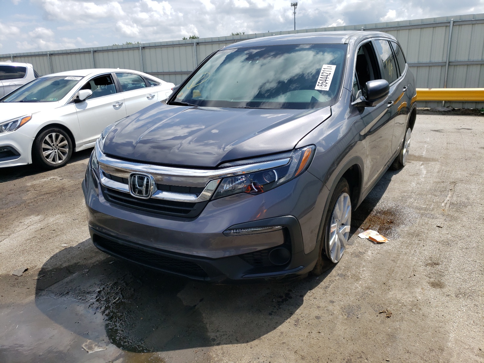 Photo 2 from auction – 2019 HONDA PILOT LX with VIN 5FNYF6H10KB100055