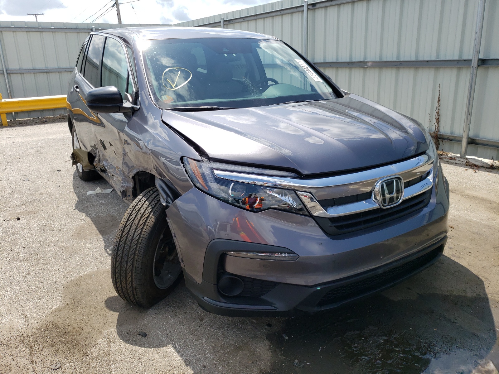 HONDA PILOT LX 2019 with VIN 5FNYF6H10KB100055 - Photo from auction
