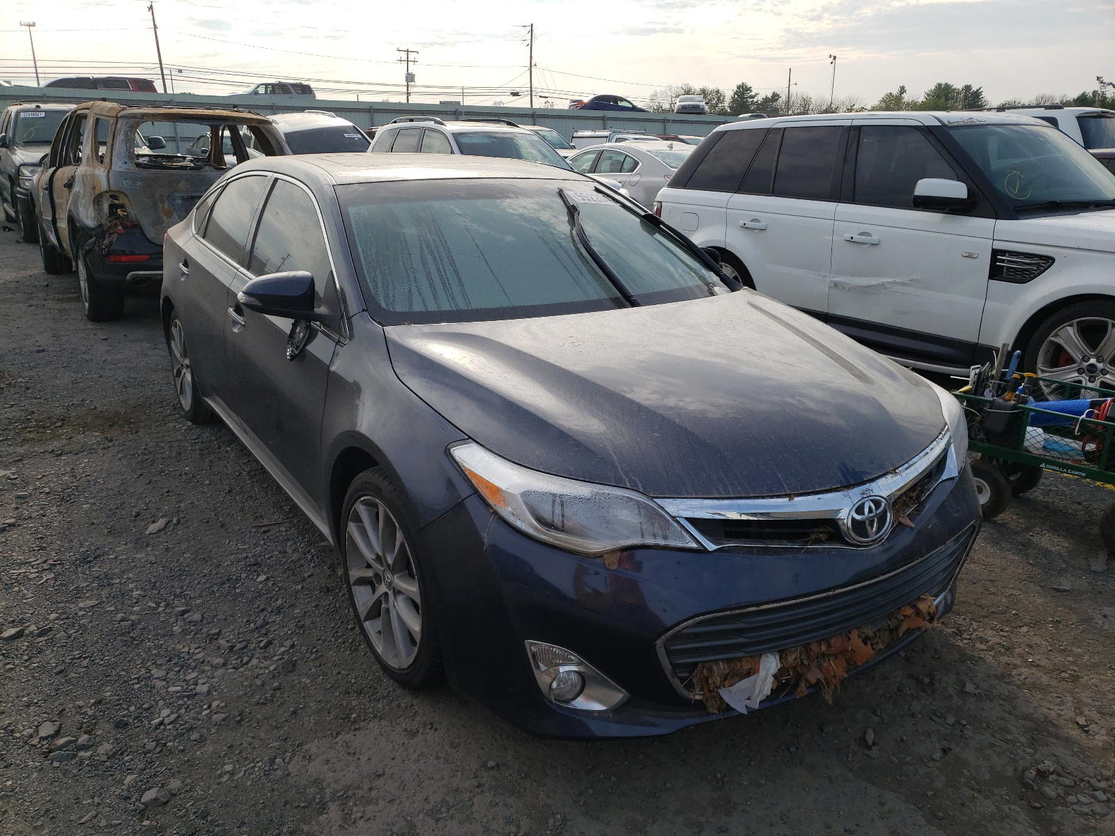 TOYOTA AVALON 2014 with VIN 4T1BK1EB4EU134685 - Photo from auction
