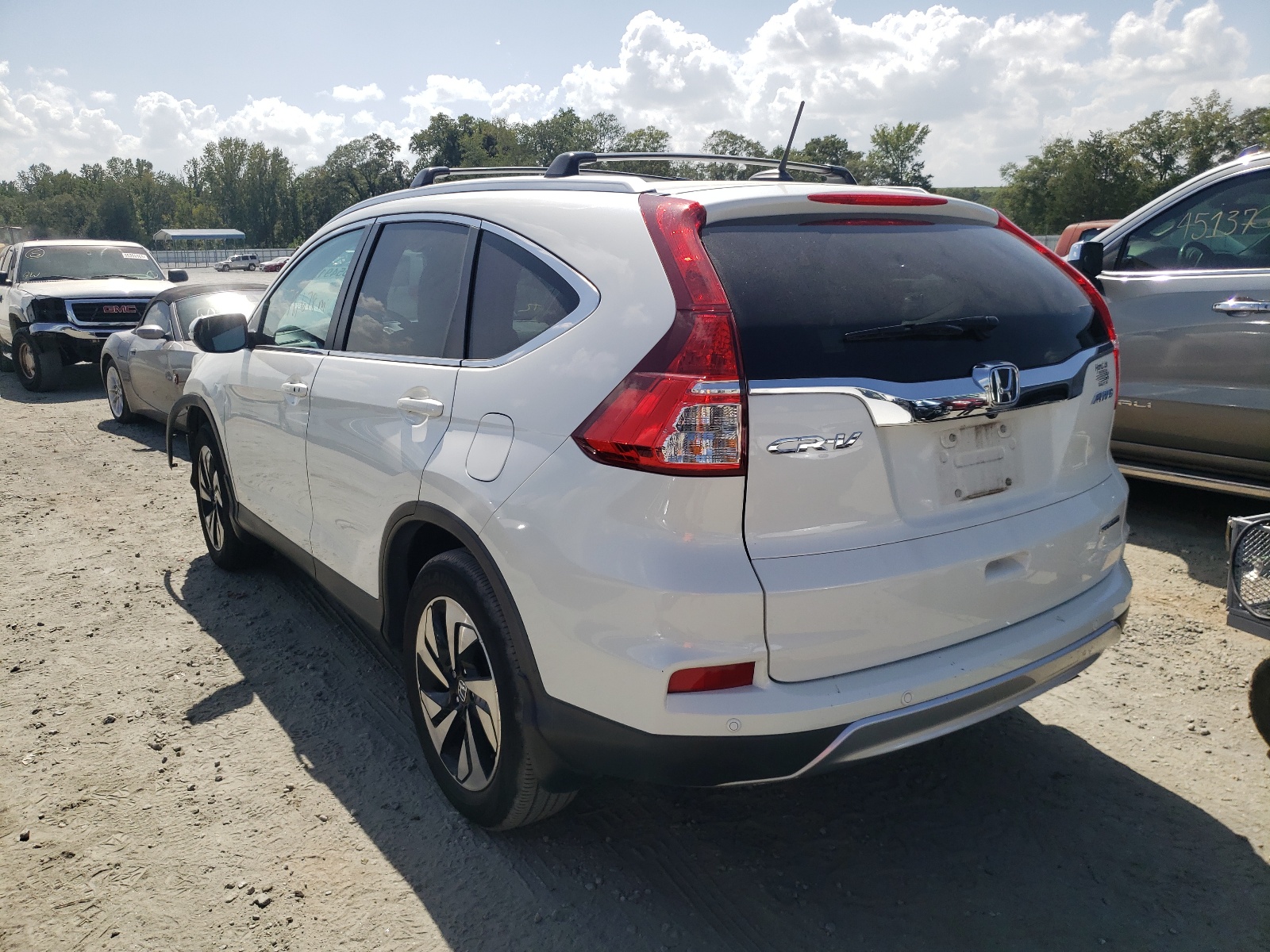 Photo 3 from auction – 2015 HONDA CR-V TOURI with VIN 5J6RM4H90FL116239