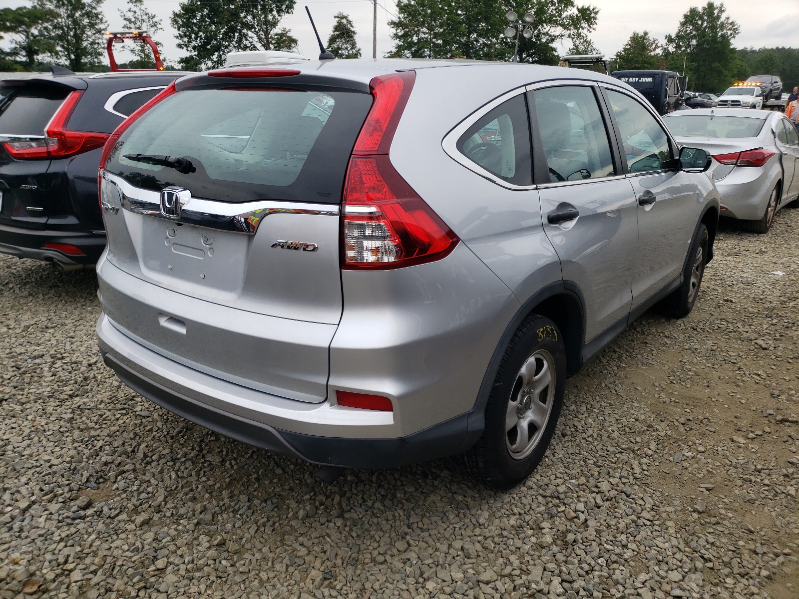 Photo 4 from auction – 2015 HONDA CR-V LX with VIN 2HKRM4H34FH696536