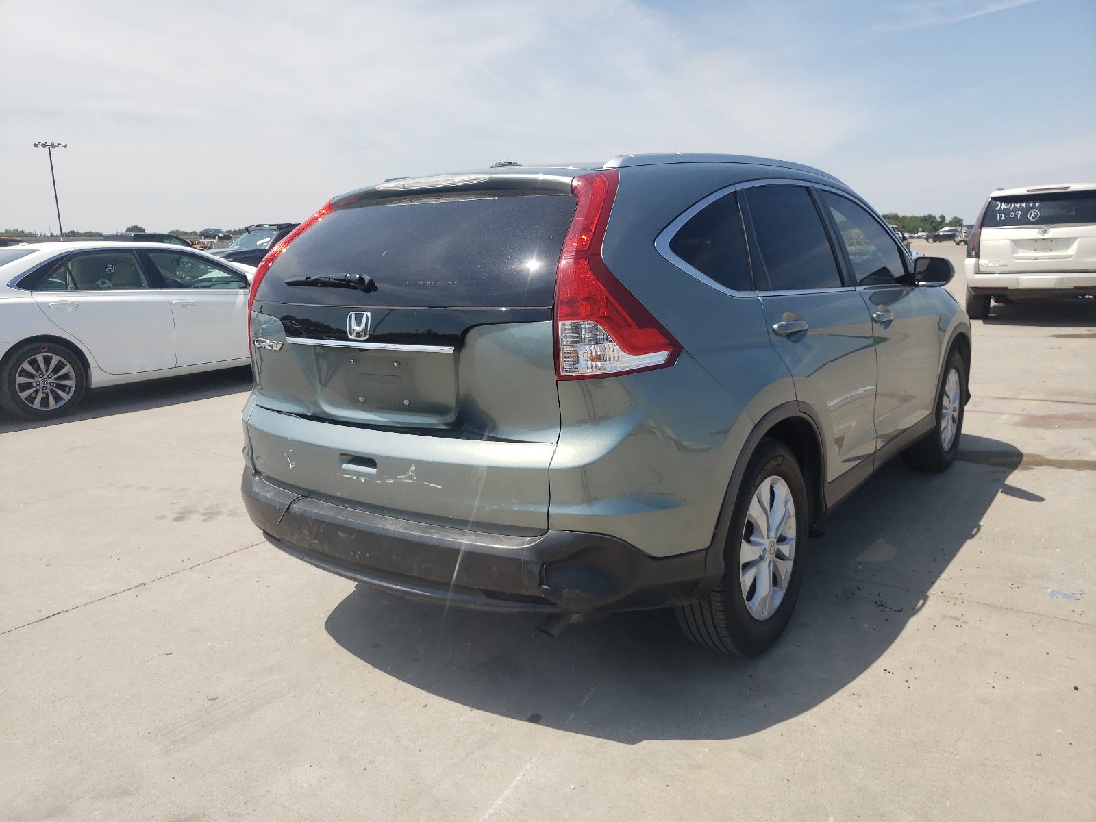 Photo 4 from auction – 2012 HONDA CR-V EXL with VIN 5J6RM3H74CL015788