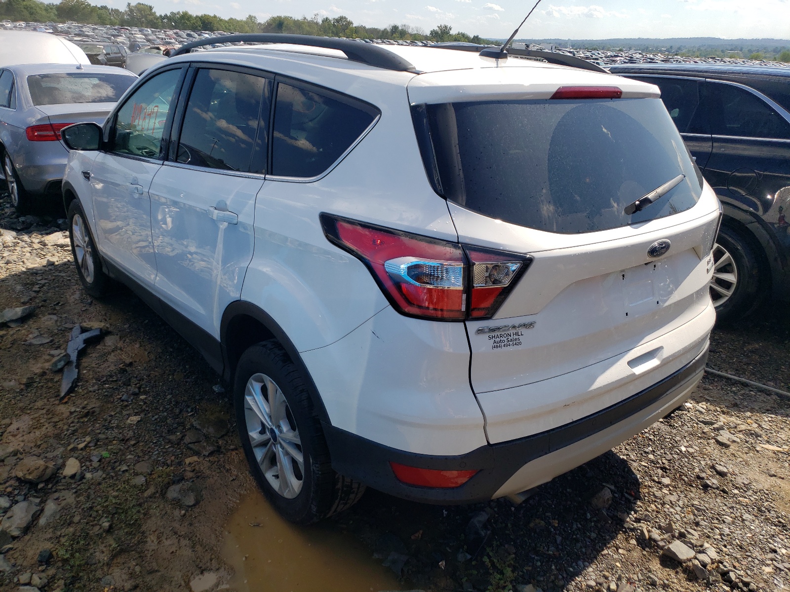 Photo 3 from auction – 2018 FORD ESCAPE SE with VIN 1FMCU9GD0JUA32760