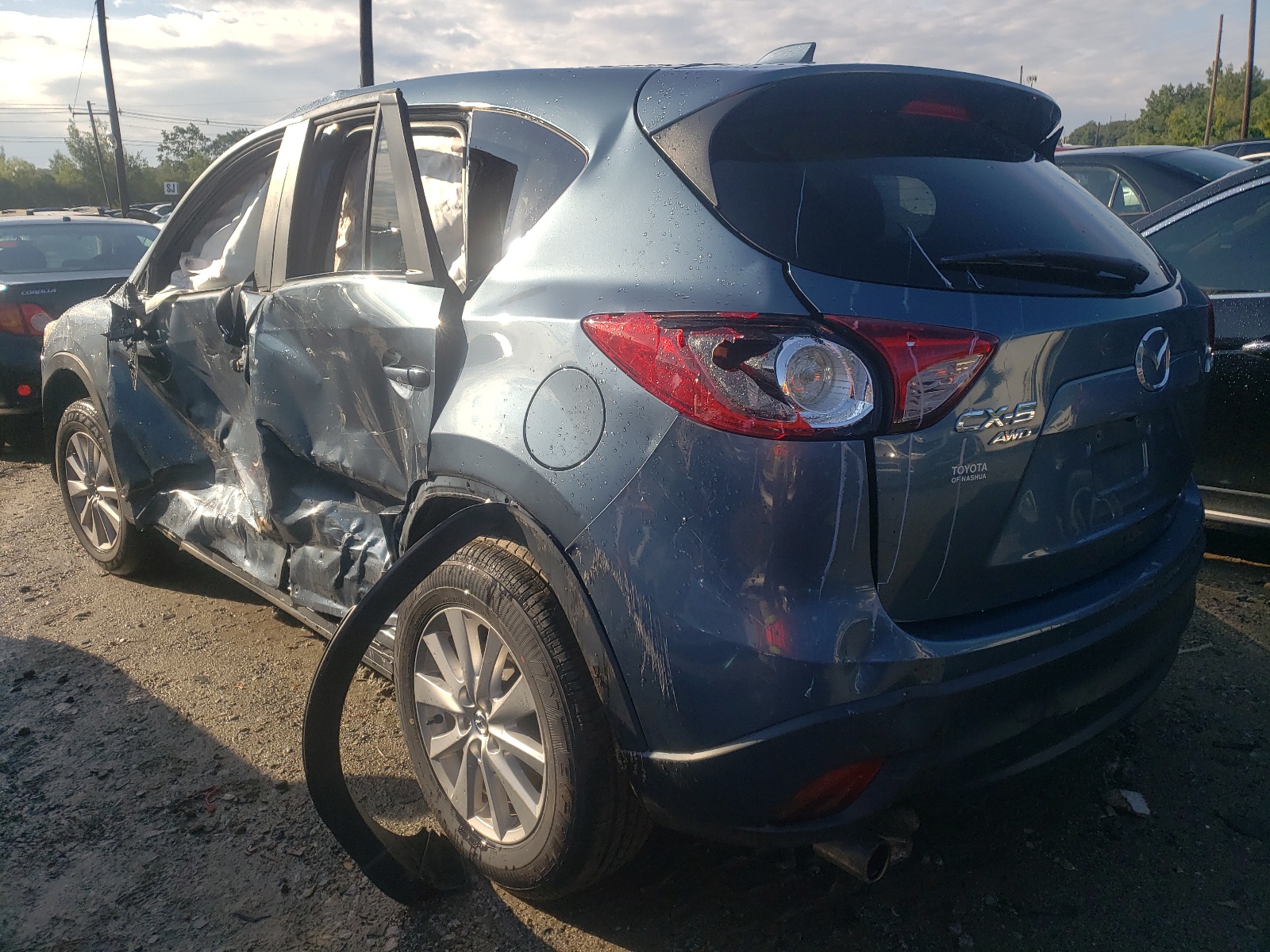 Photo 3 from auction – 2015 MAZDA CX-5 TOURI with VIN JM3KE4CYXF0475299