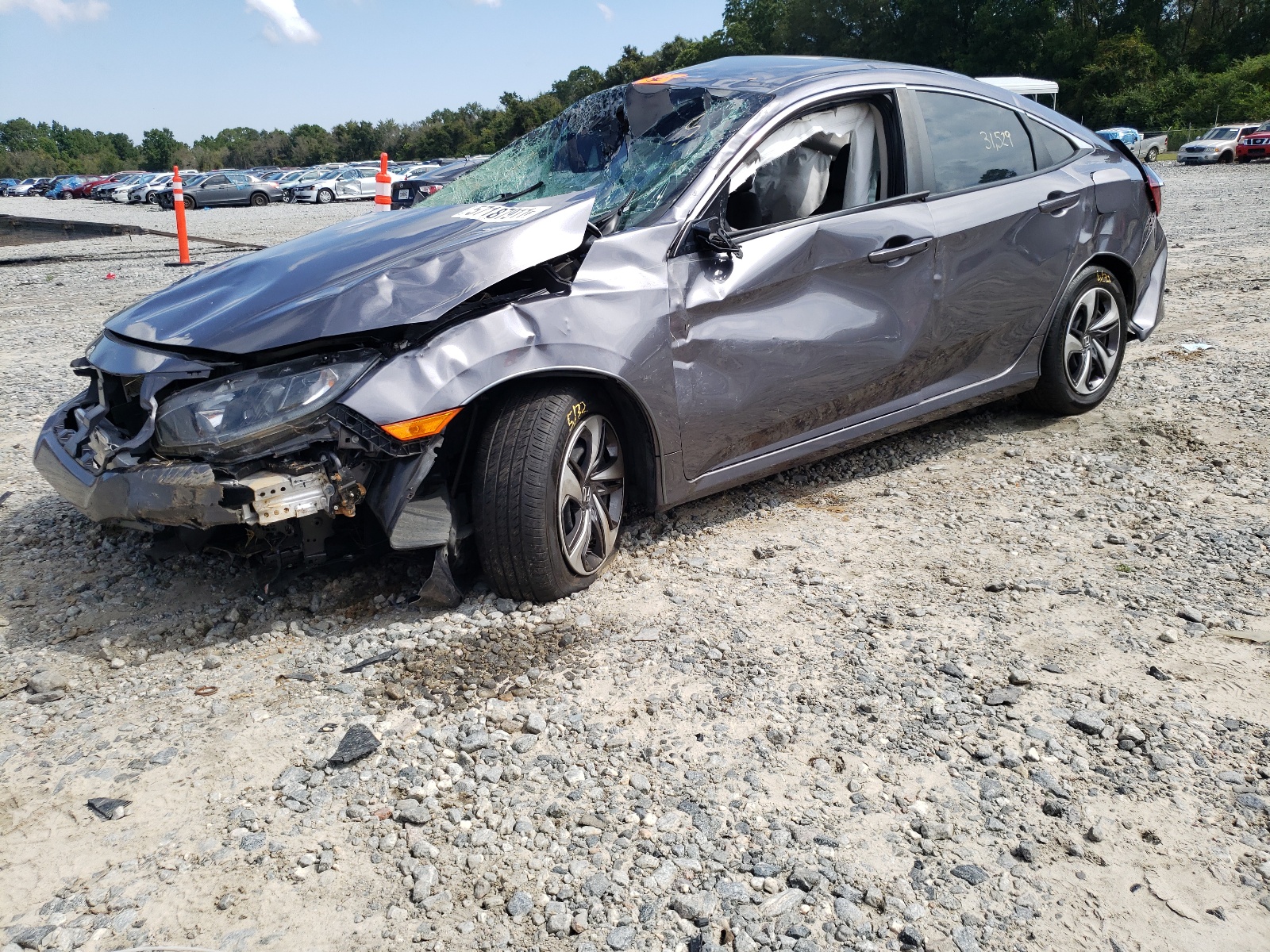 Photo 2 from auction – 2019 HONDA CIVIC LX with VIN 19XFC2F68KE042127