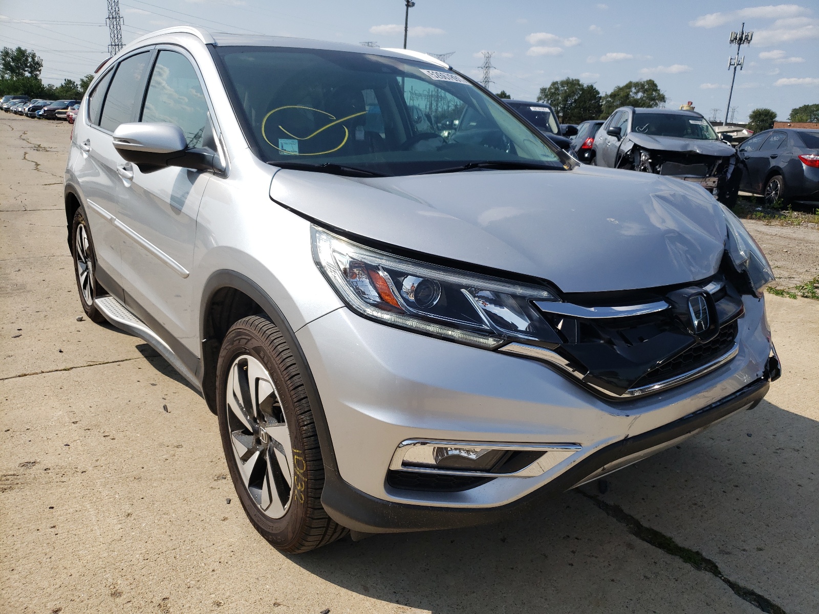 HONDA CR-V TOURI 2016 with VIN 5J6RM4H98GL075991 - Photo from auction