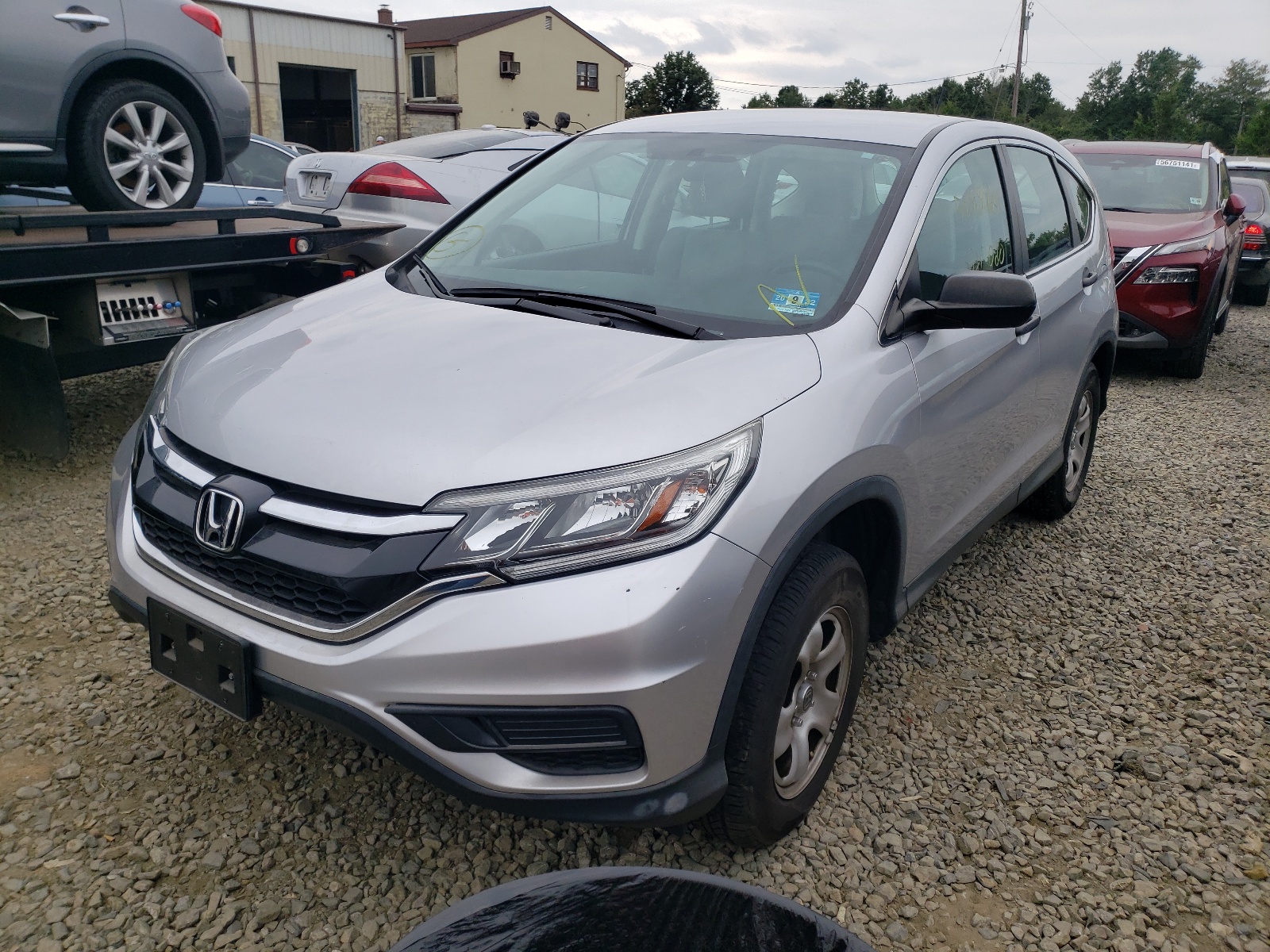 Photo 2 from auction – 2015 HONDA CR-V LX with VIN 2HKRM4H34FH696536