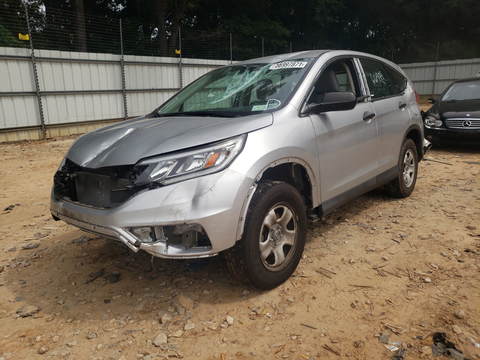 Photo 2 from auction – 2016 HONDA CR-V LX with VIN 5J6RM4H31GL129238