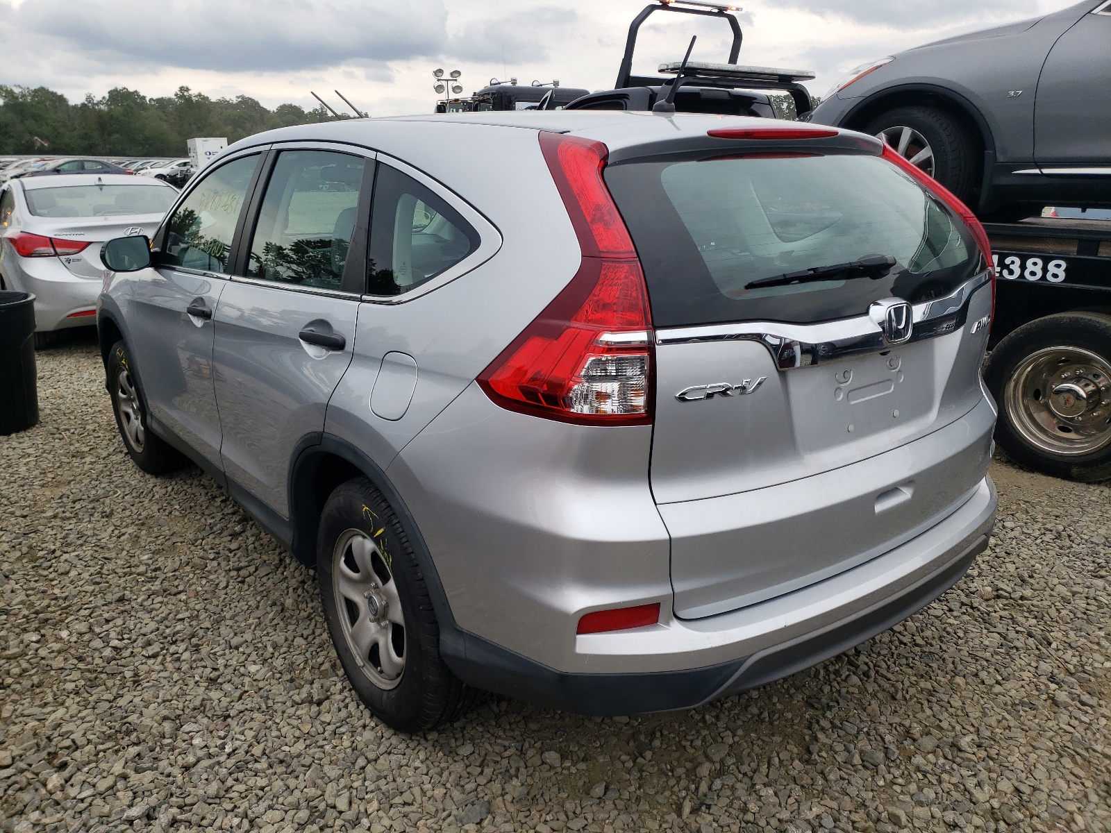 Photo 3 from auction – 2015 HONDA CR-V LX with VIN 2HKRM4H34FH696536