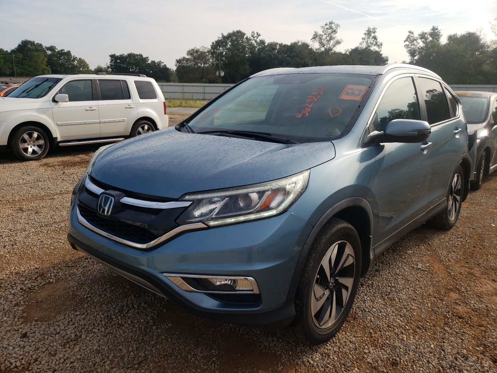 Photo 2 from auction – 2016 HONDA CR-V TOURI with VIN 5J6RM4H90GL013680