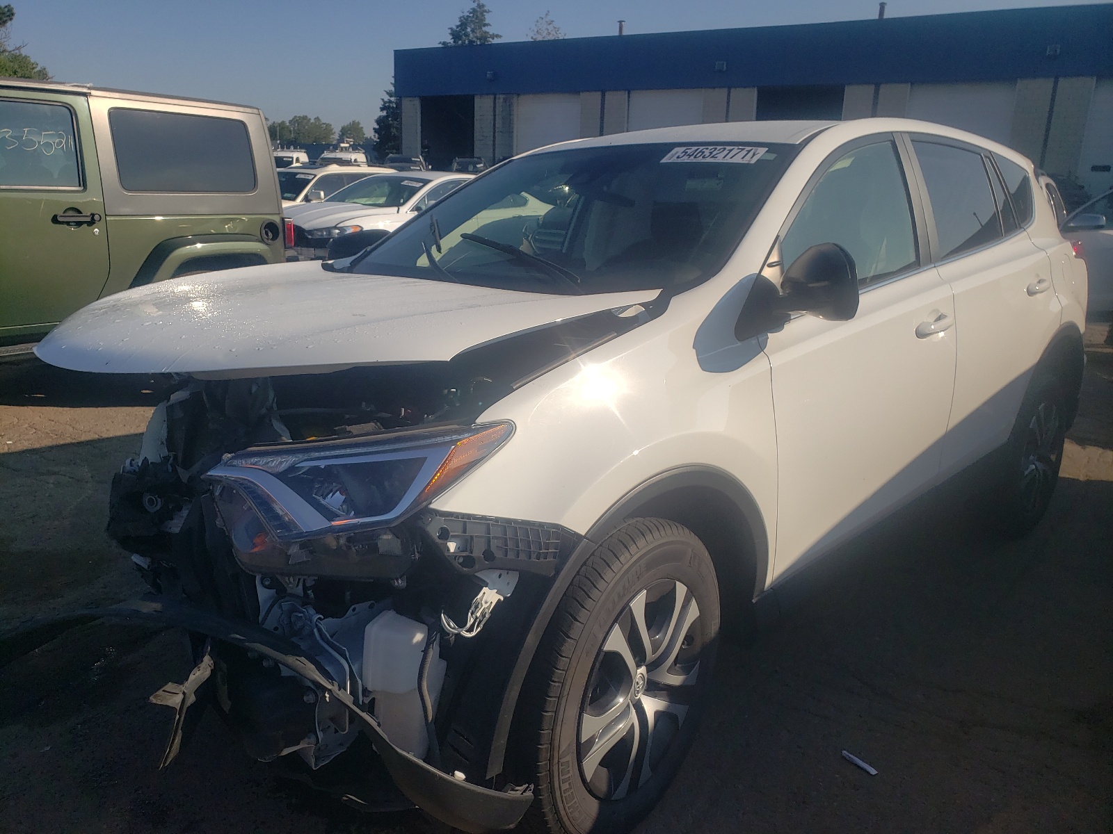 Photo 2 from auction – 2018 TOYOTA RAV4 LE with VIN JTMBFREV8JJ182249