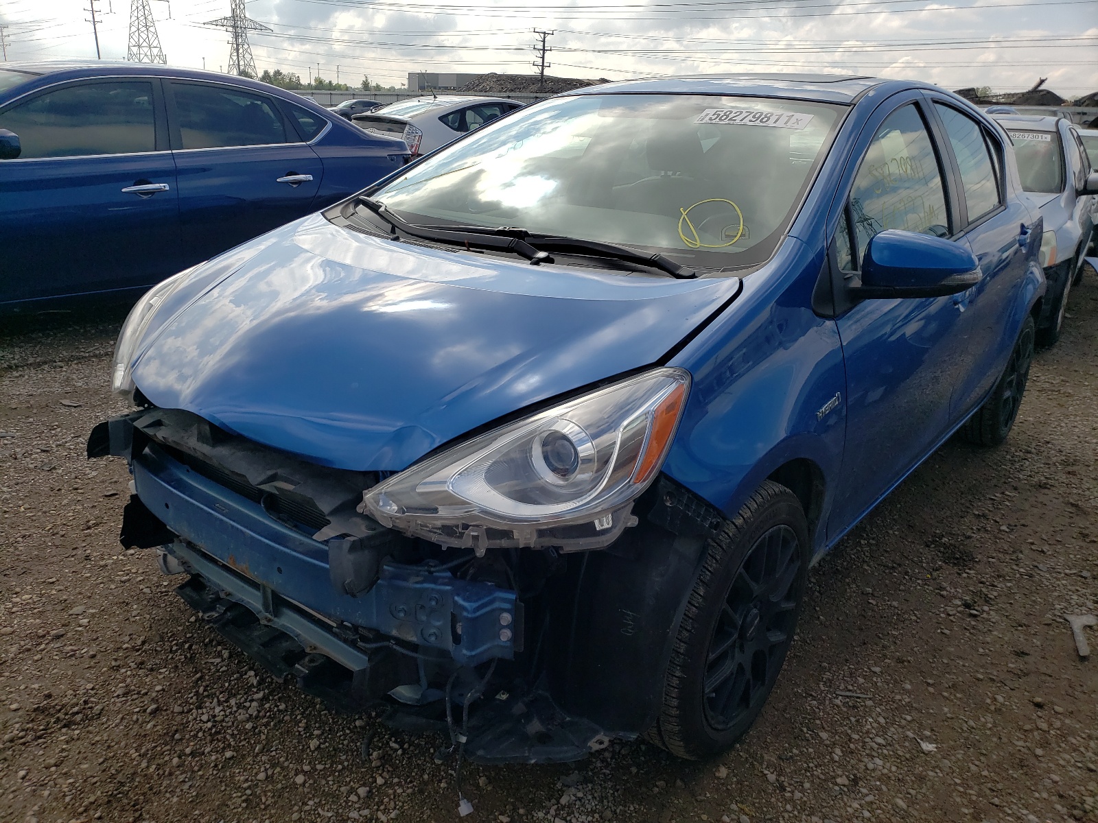 Photo 2 from auction – 2015 TOYOTA PRIUS C with VIN JTDKDTB30F1109681