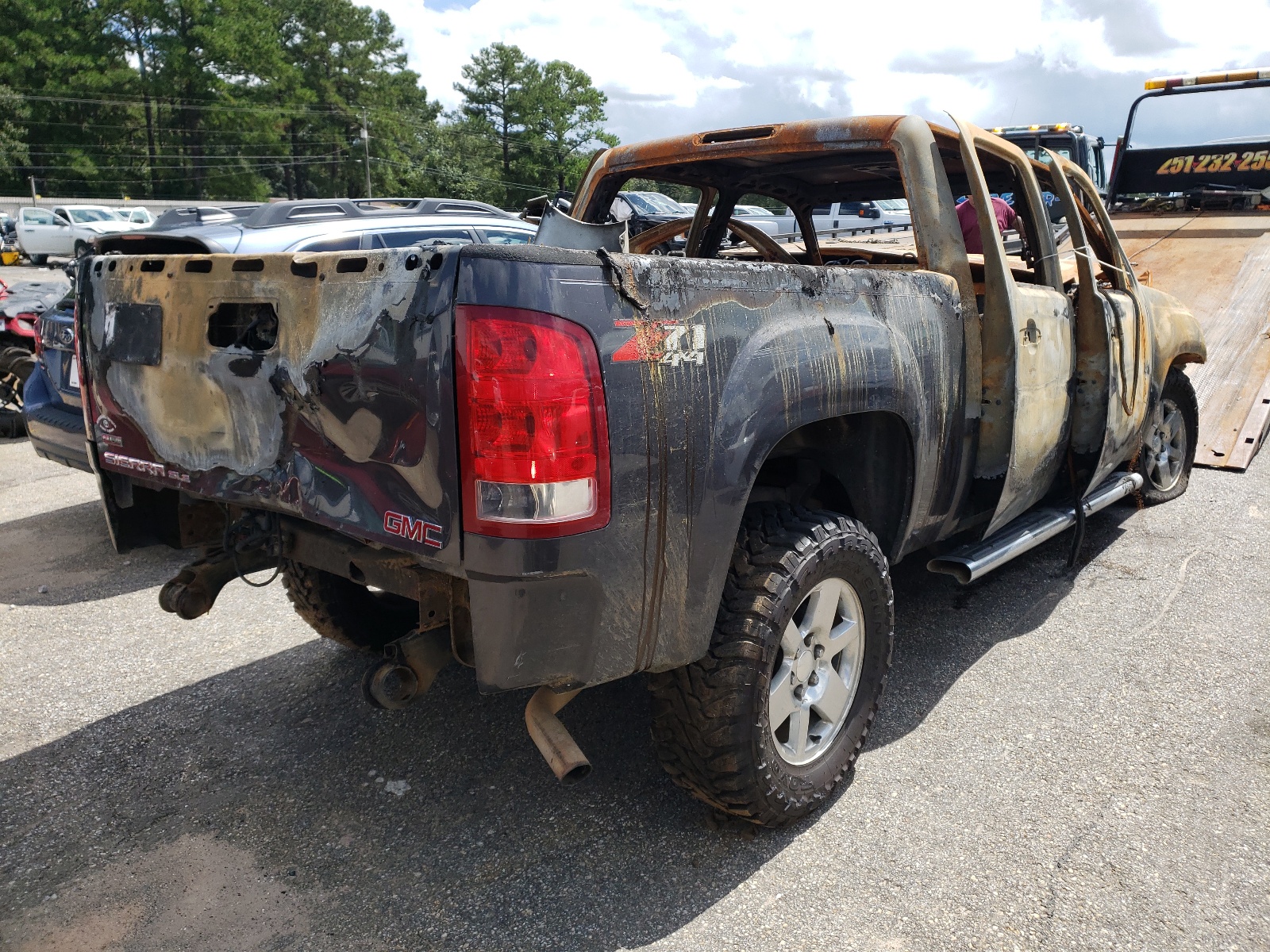 Photo 4 from auction – 2011 GMC SIERRA K15 with VIN 3GTP2VE33BG180419