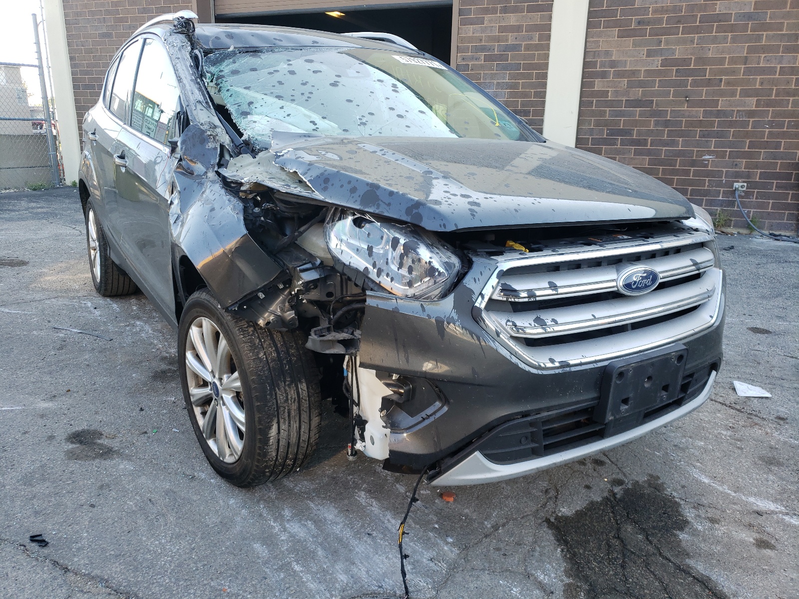 FORD ESCAPE TIT 2018 with VIN 1FMCU9J94JUB68636 - Photo from auction