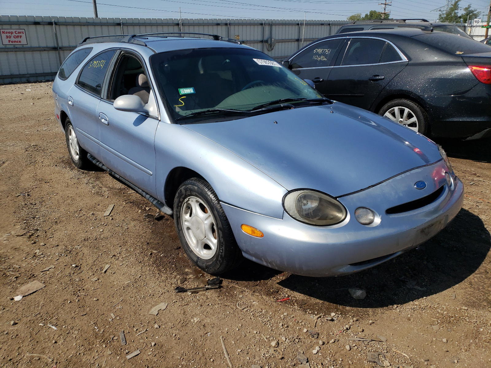 FORD TAURUS GL 1997 with VIN 1FALP57U5VG299536 - Photo from auction