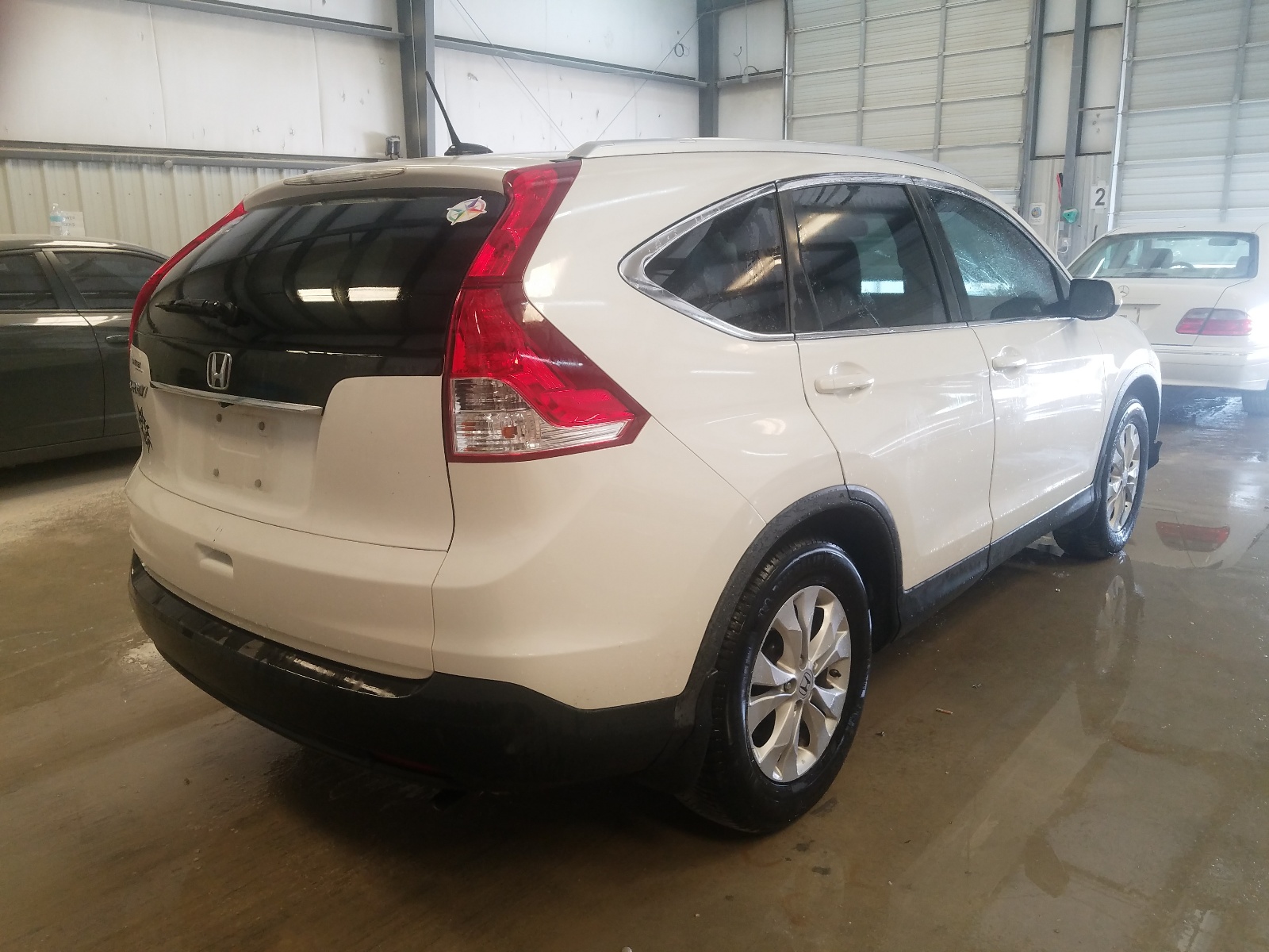 Photo 4 from auction – 2013 HONDA CR-V EXL with VIN 5J6RM3H79DL033687