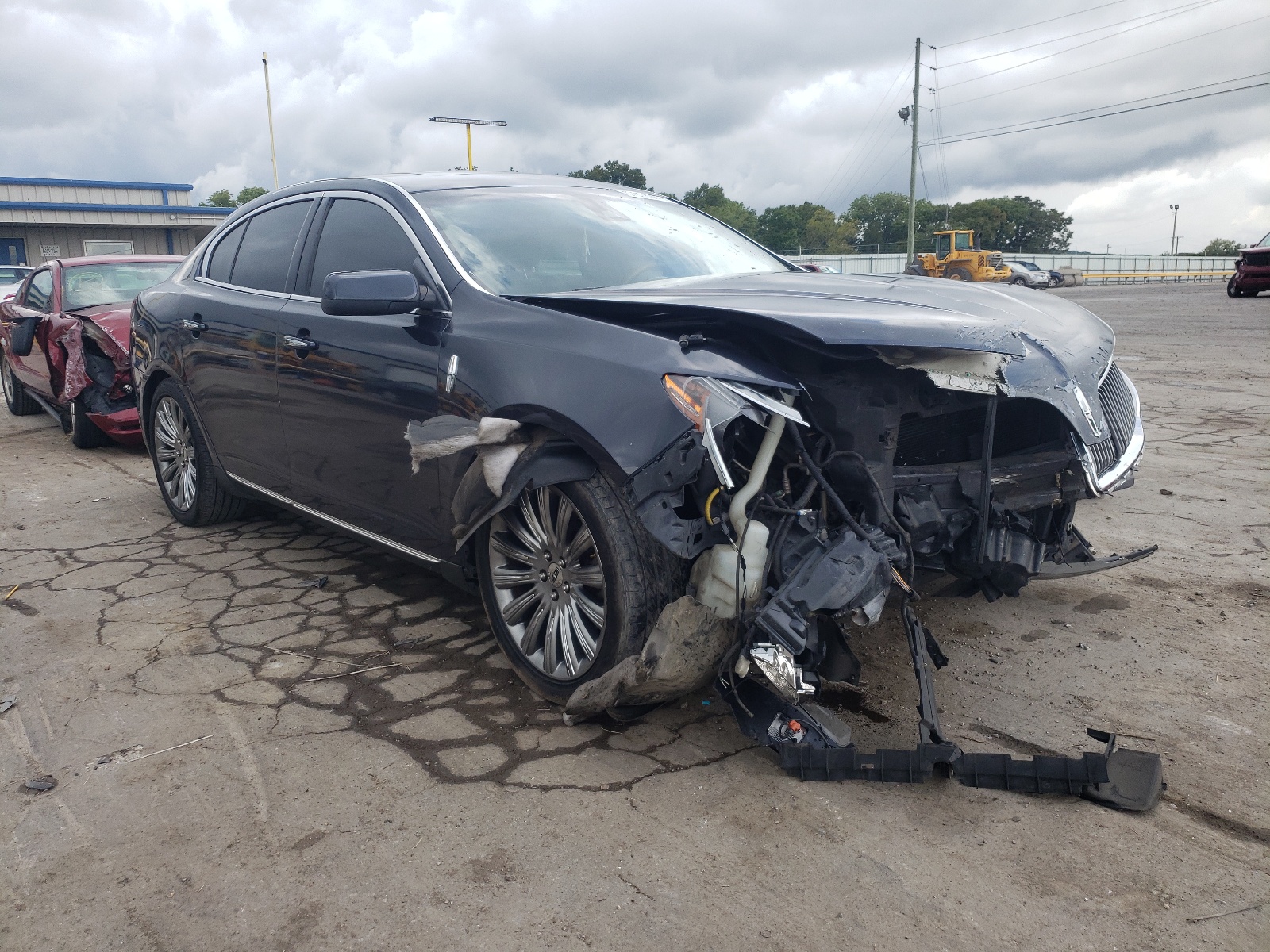 LINCOLN MKS 2014 with VIN 1LNHL9EK8EG610375 - Photo from auction