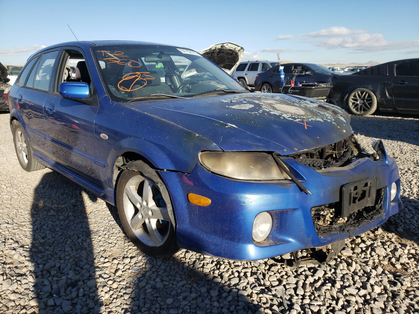 MAZDA PROTEGE 2003 with VIN JM1BJ245931185090 - Photo from auction