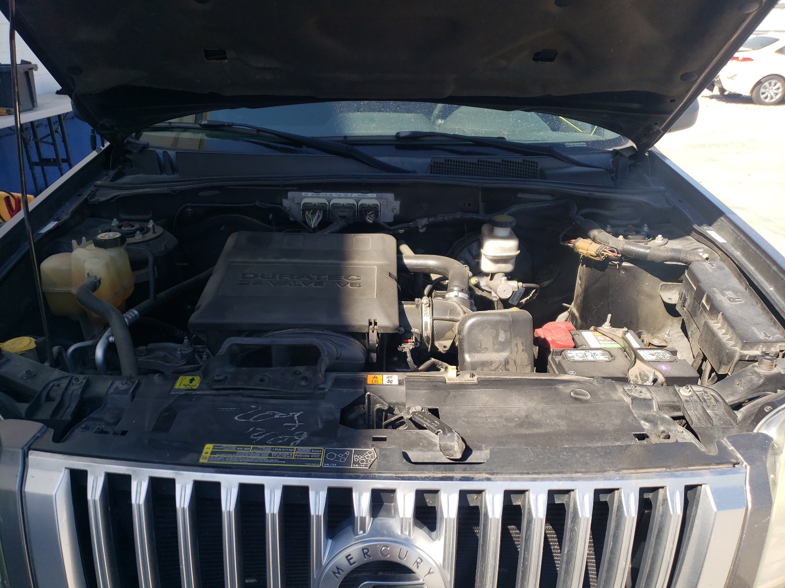 Photo 7 from auction – 2009 MERCURY MARINER with VIN 4M2CU81G89KJ19793