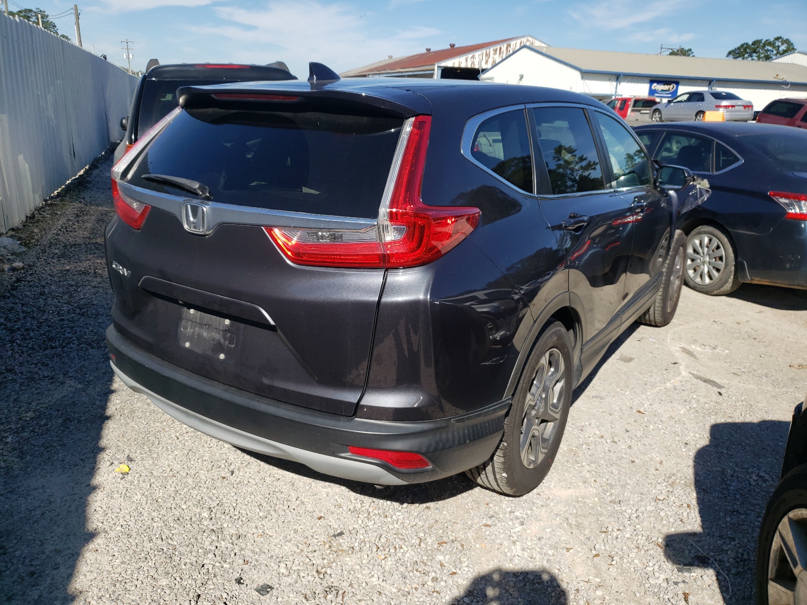 Photo 4 from auction – 2017 HONDA CR-V EXL with VIN 7FARW1H84HE011588