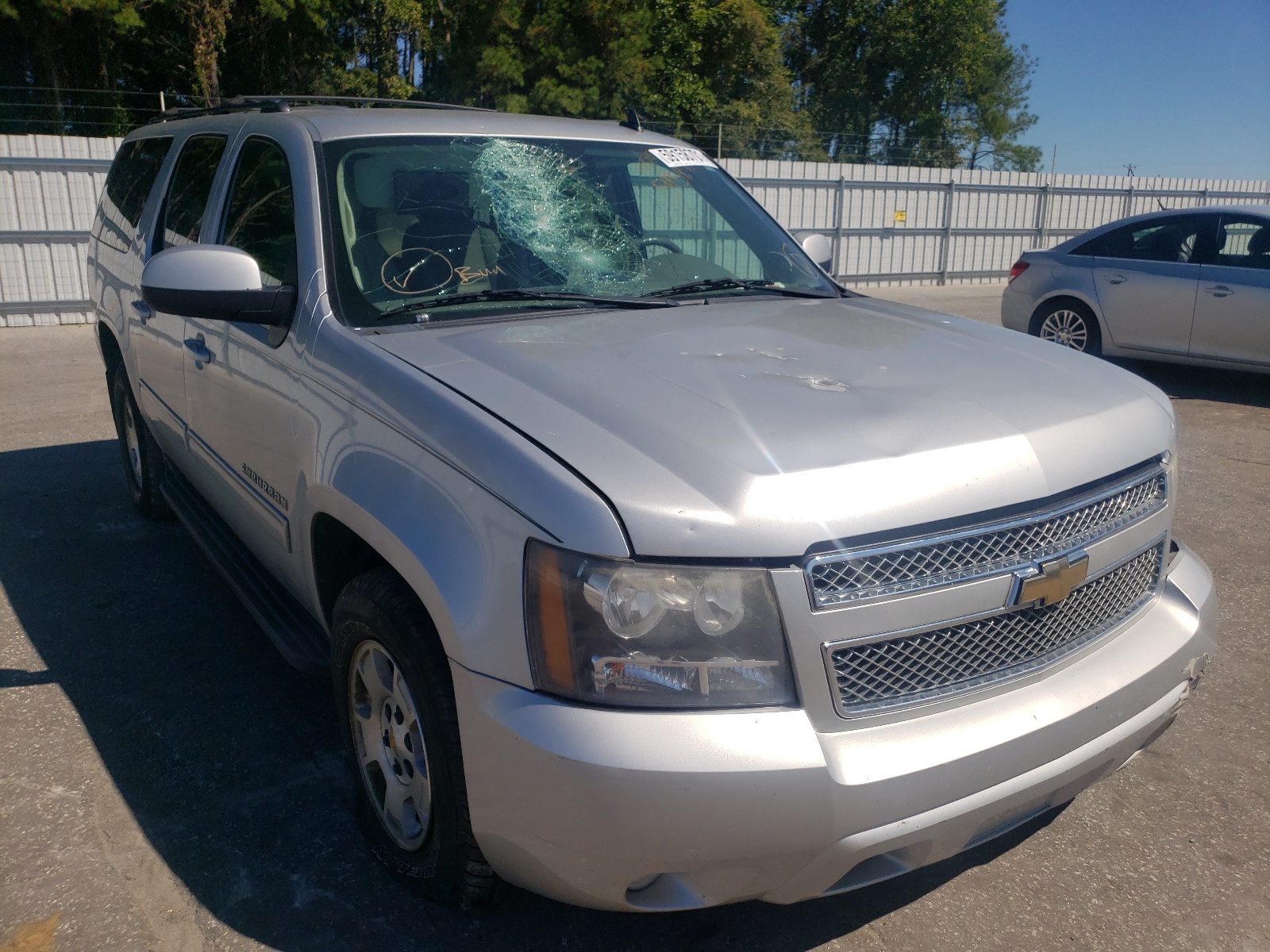 CHEVROLET SUBURBAN C 2011 with VIN 1GNSCJE00BR219223 - Photo from auction