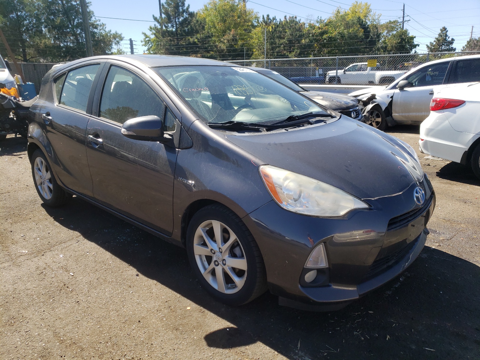 TOYOTA PRIUS C 2013 with VIN JTDKDTB34D1053628 - Photo from auction