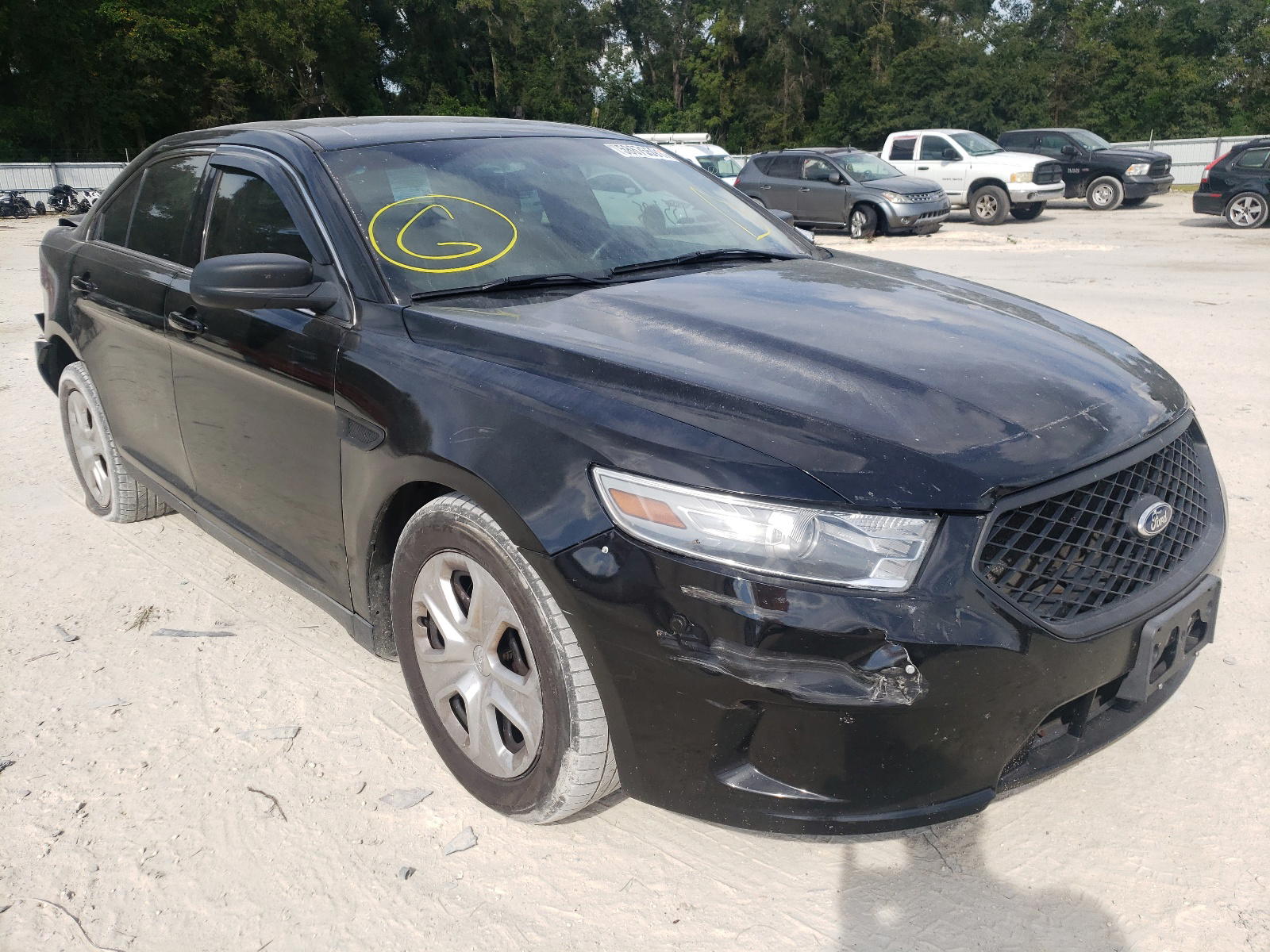 FORD TAURUS POL 2013 with VIN 1FAHP2M85DG110474 - Photo from auction