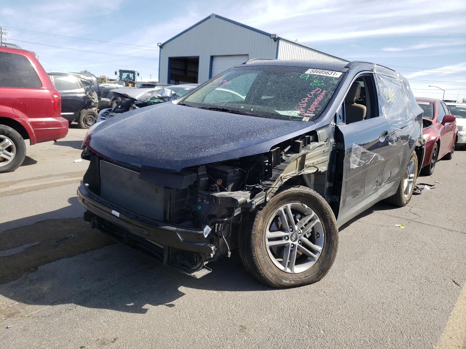 Photo 2 from auction – 2017 HYUNDAI SANTA FE S with VIN 5NMZU3LB7HH015312