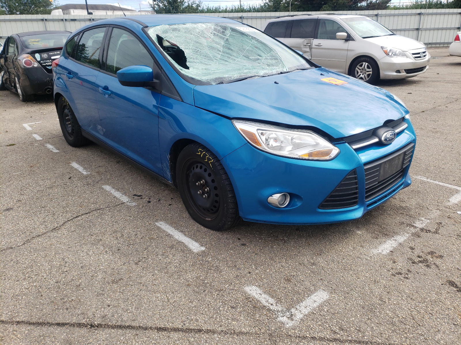 FORD FOCUS SE 2012 with VIN 1FAHP3K2XCL464758 - Photo from auction
