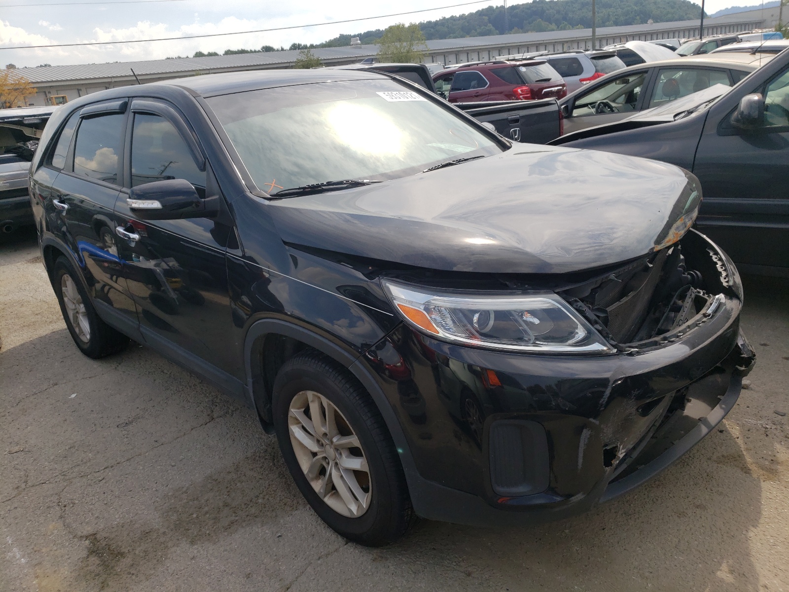 KIA SORENTO LX 2015 with VIN 5XYKT3A64FG582367 - Photo from auction