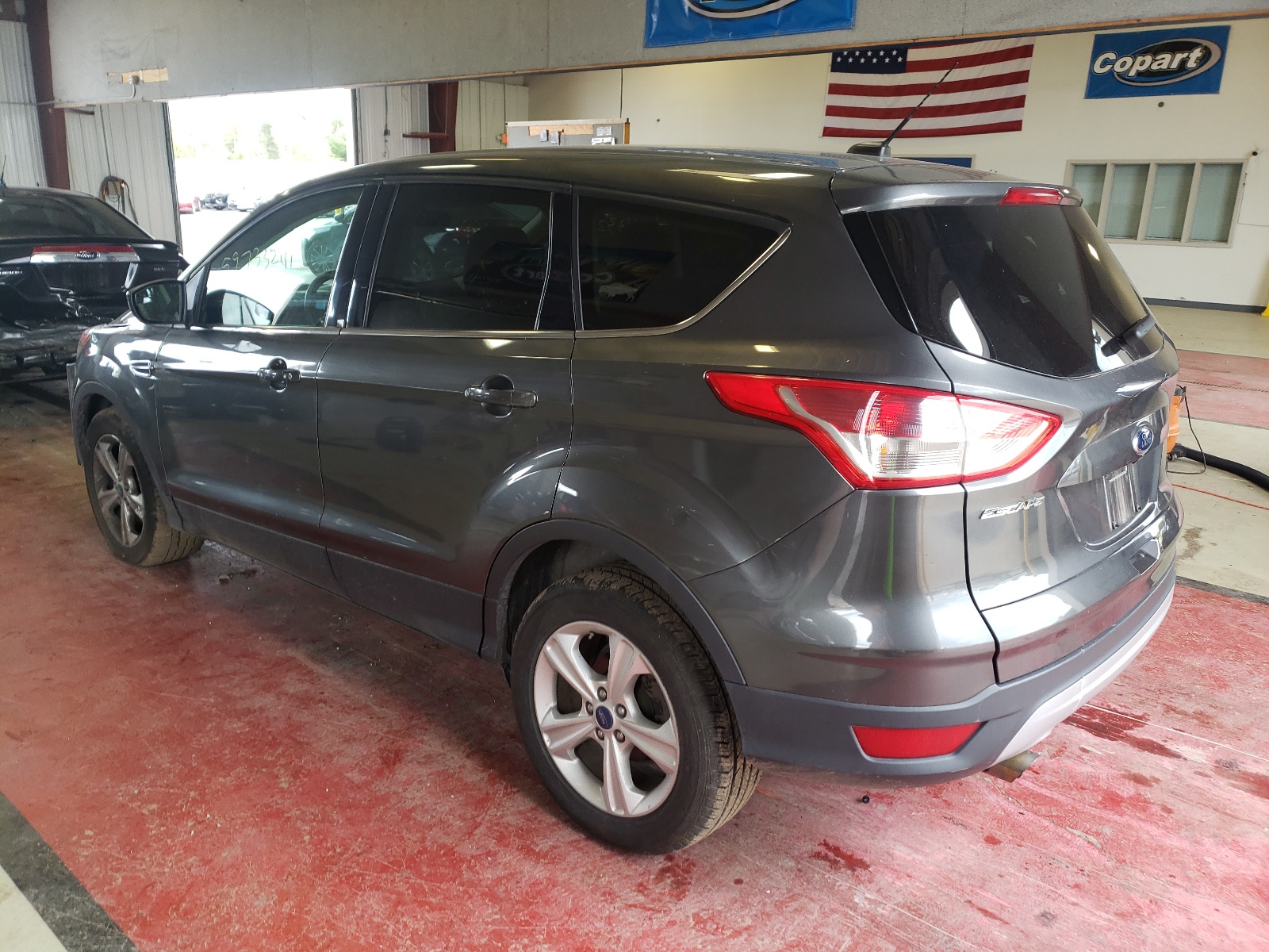 Photo 3 from auction – 2016 FORD ESCAPE SE with VIN 1FMCU9GX7GUA16932