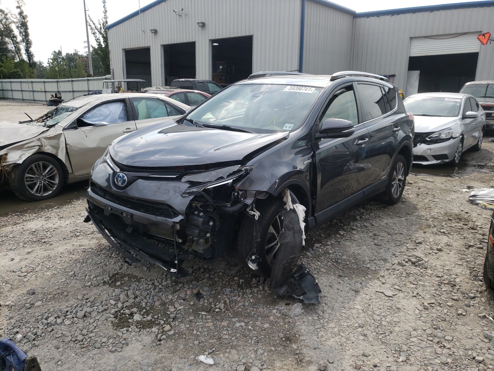 Photo 2 from auction – 2017 TOYOTA RAV4 HV LE with VIN JTMRJREV5HD079649