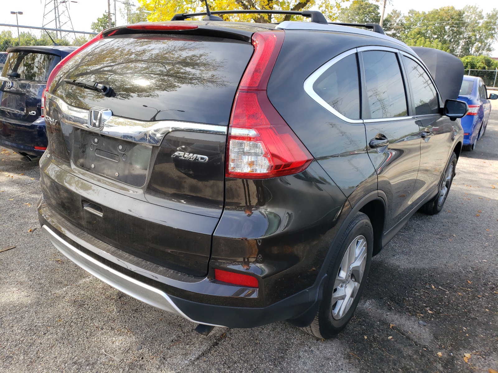 Photo 4 from auction – 2016 HONDA CR-V EXL with VIN 5J6RM4H71GL112376