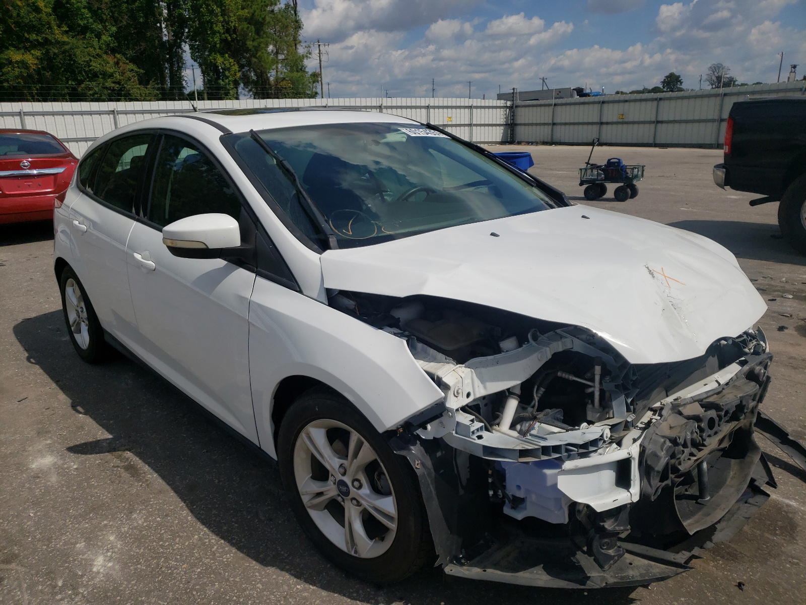 FORD FOCUS SE 2014 with VIN 1FADP3K23EL225439 - Photo from auction