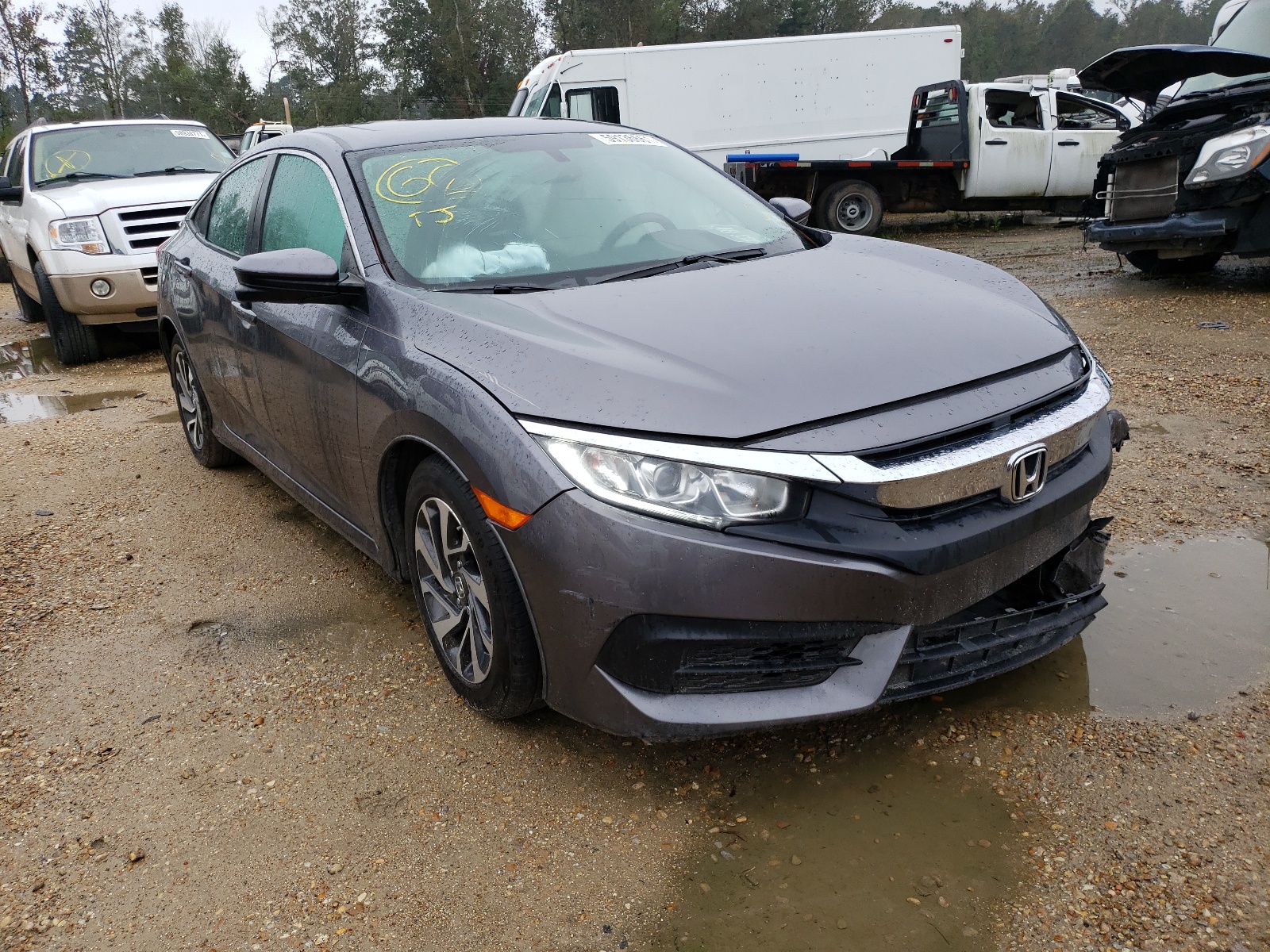 HONDA CIVIC EX 2018 with VIN 19XFC2F77JE032082 - Photo from auction