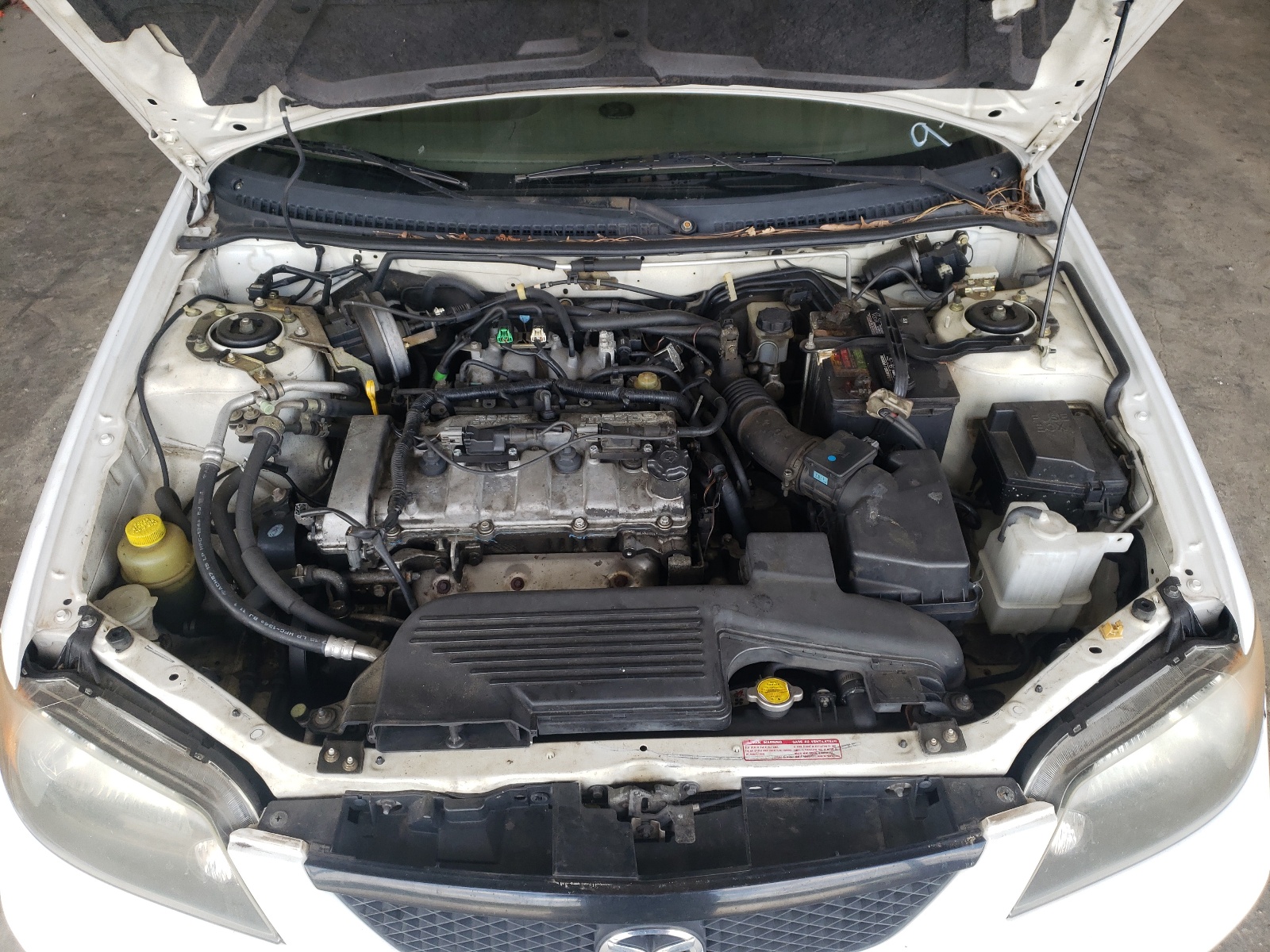 Photo 7 from auction – 2003 MAZDA PROTEGE DX with VIN JM1BJ225X30142127