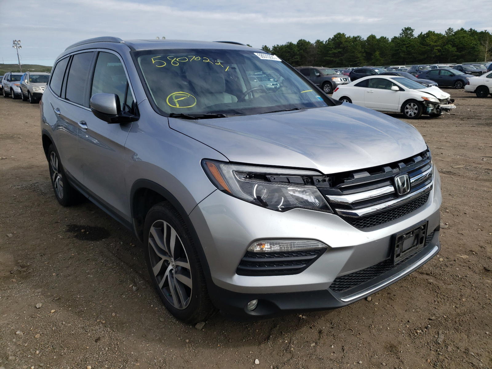 HONDA PILOT ELIT 2016 with VIN 5FNYF6H06GB027367 - Photo from auction