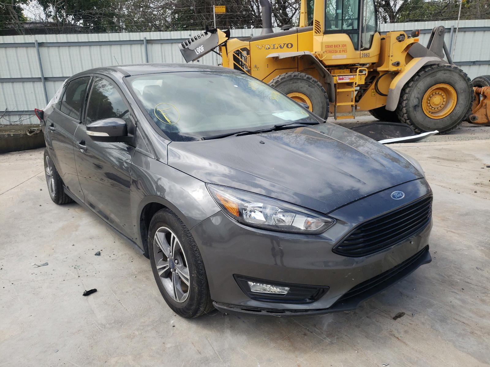 FORD FOCUS SE 2017 with VIN 1FADP3FE7HL341476 - Photo from auction