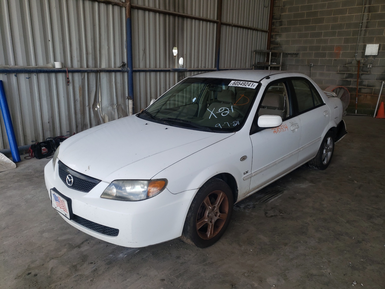 Photo 2 from auction – 2003 MAZDA PROTEGE DX with VIN JM1BJ225X30142127