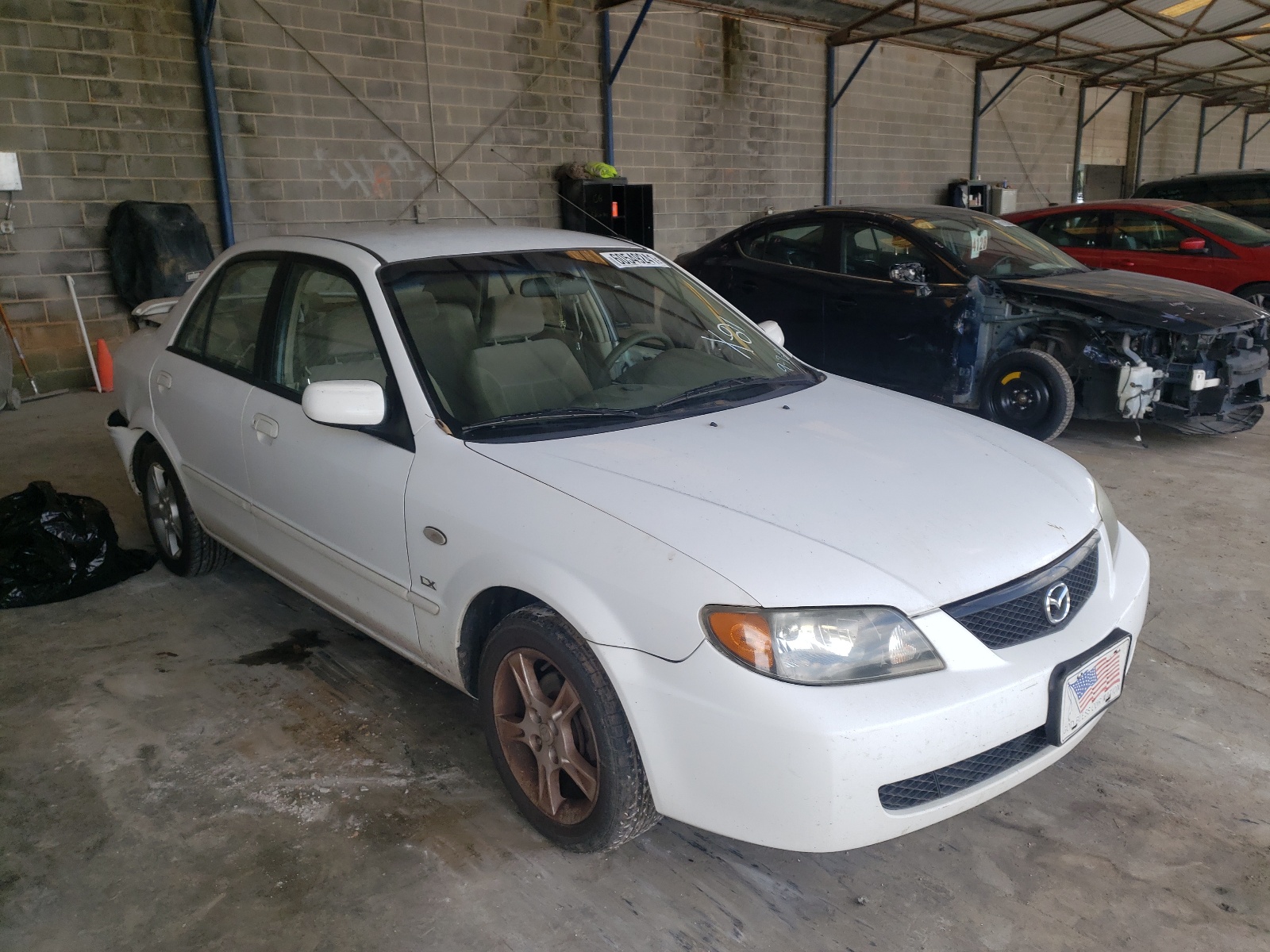 Photo 1 from auction – 2003 MAZDA PROTEGE DX with VIN JM1BJ225X30142127