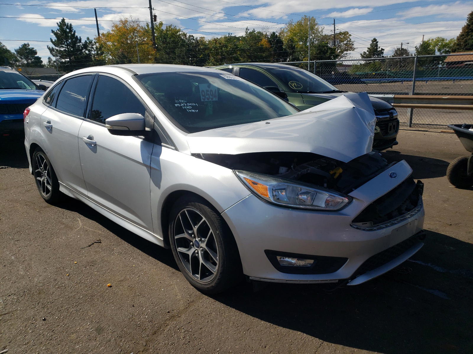 FORD FOCUS SE 2015 with VIN 1FADP3F29FL300043 - Photo from auction