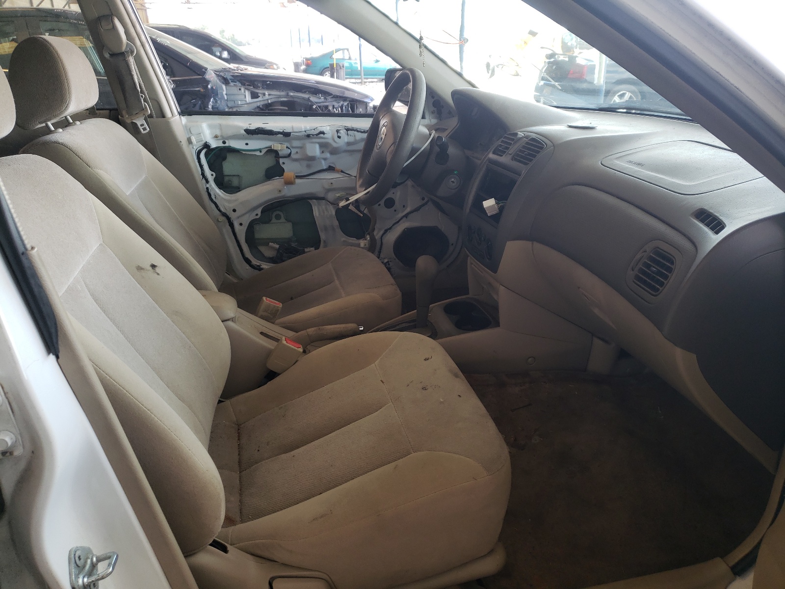 Photo 5 from auction – 2003 MAZDA PROTEGE DX with VIN JM1BJ225X30142127