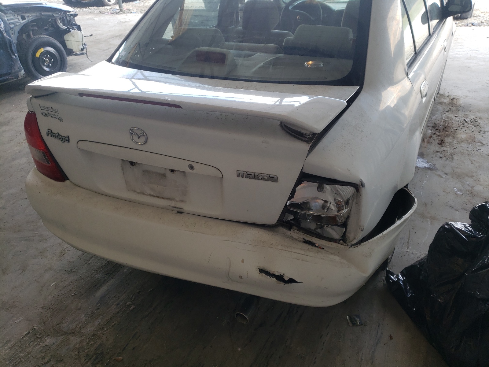 Photo 9 from auction – 2003 MAZDA PROTEGE DX with VIN JM1BJ225X30142127