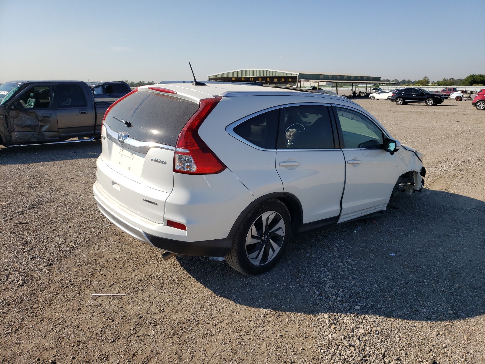 Photo 4 from auction – 2016 HONDA CR-V TOURI with VIN 5J6RM4H95GL127156
