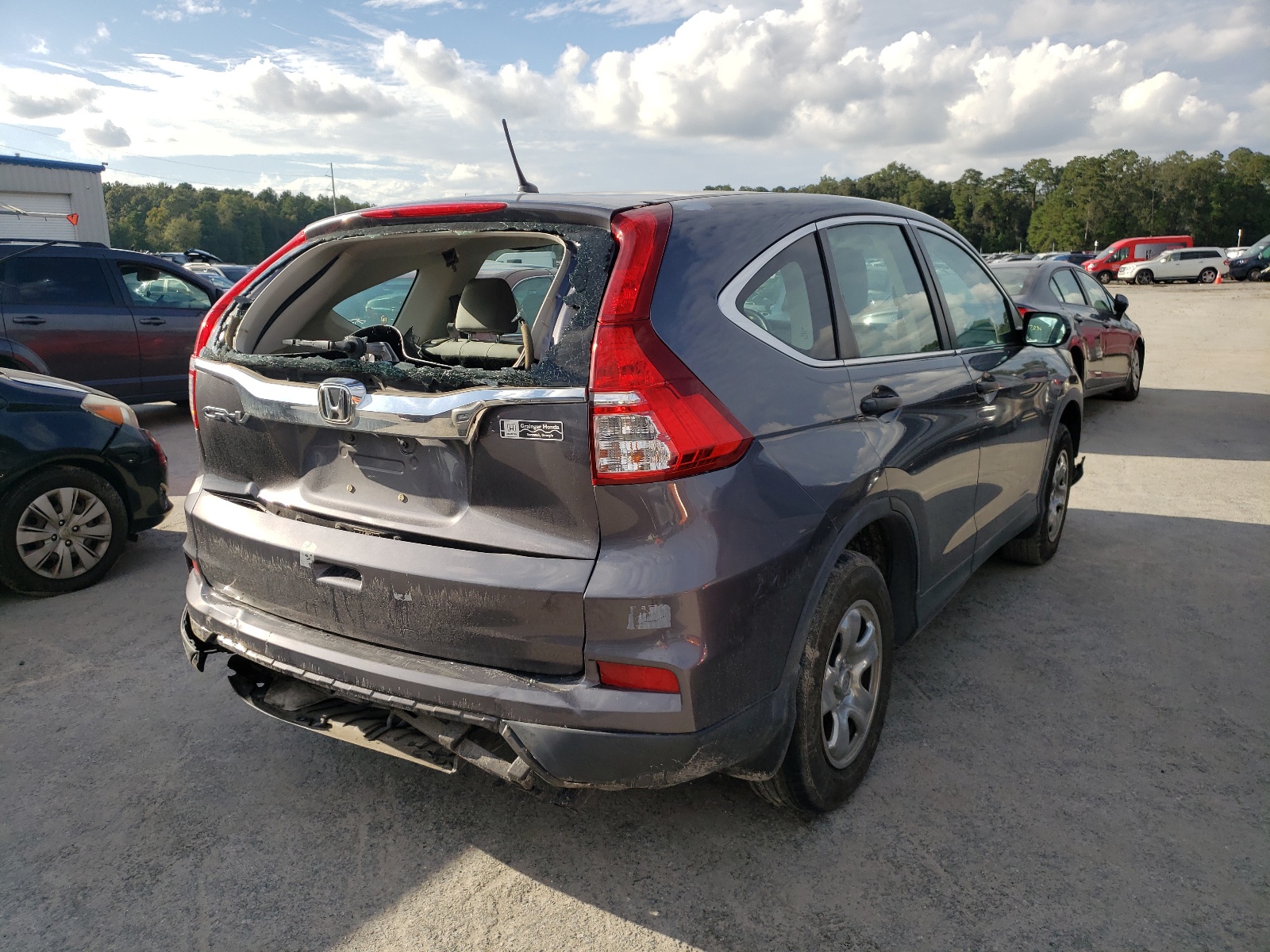 Photo 4 from auction – 2015 HONDA CR-V LX with VIN 3CZRM3H30FG704340